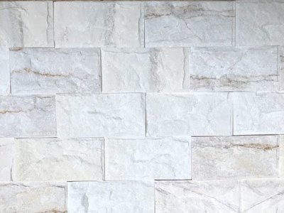 Đá tự nhiên bóc lồi màu trắng sữa ốp tường cho nhà hàng cao cấp tạo nên sự sang trọng và đẳng cấp